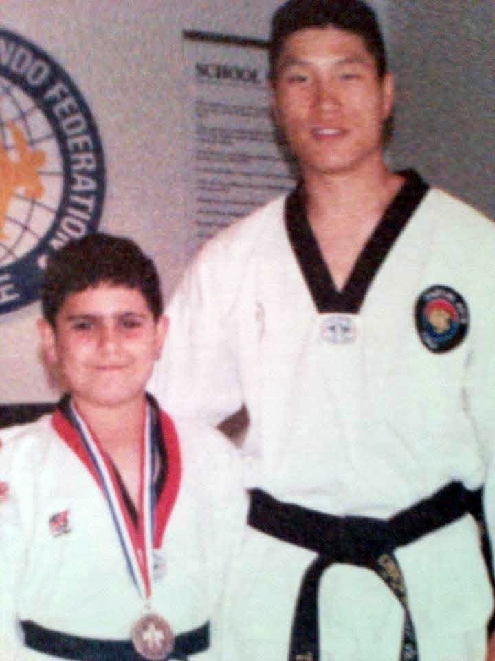 Master Milad as a boy in 1998, wearing a medal